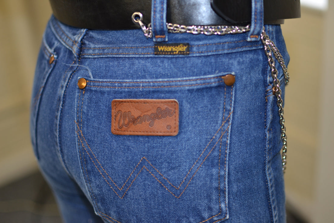 Vintage Wrangler jeans back pocket with leather brand patch at Brag Vintage