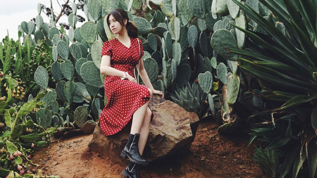 Woman wearing a red midi dress with black boots – dresses at Brag Vintage