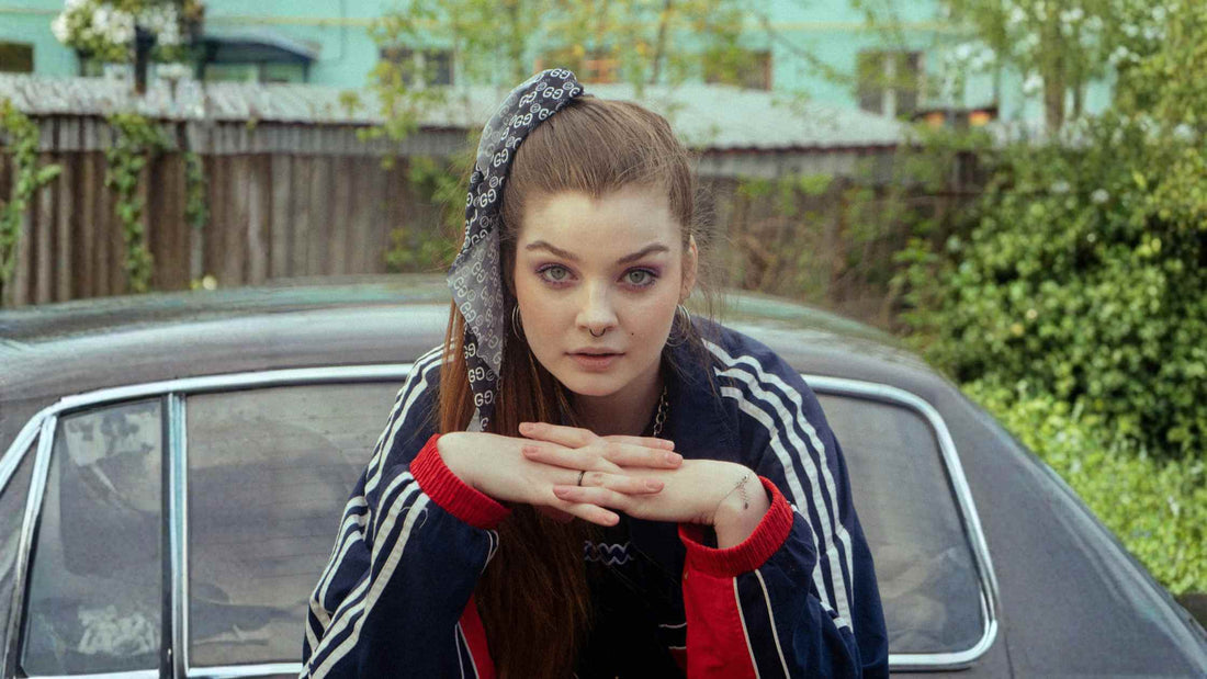 90s fashion aesthetic featuring a woman in a retro tracksuit and bandana