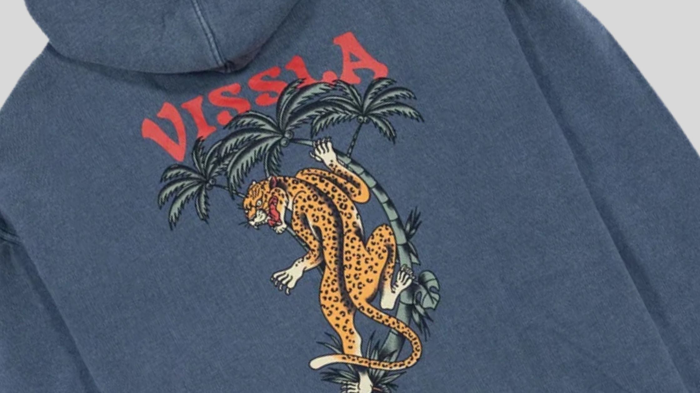 Retro Vissla hoodie design featuring a tiger and palm trees - The History of Vissla Surfwear clothing at Brag Vintage