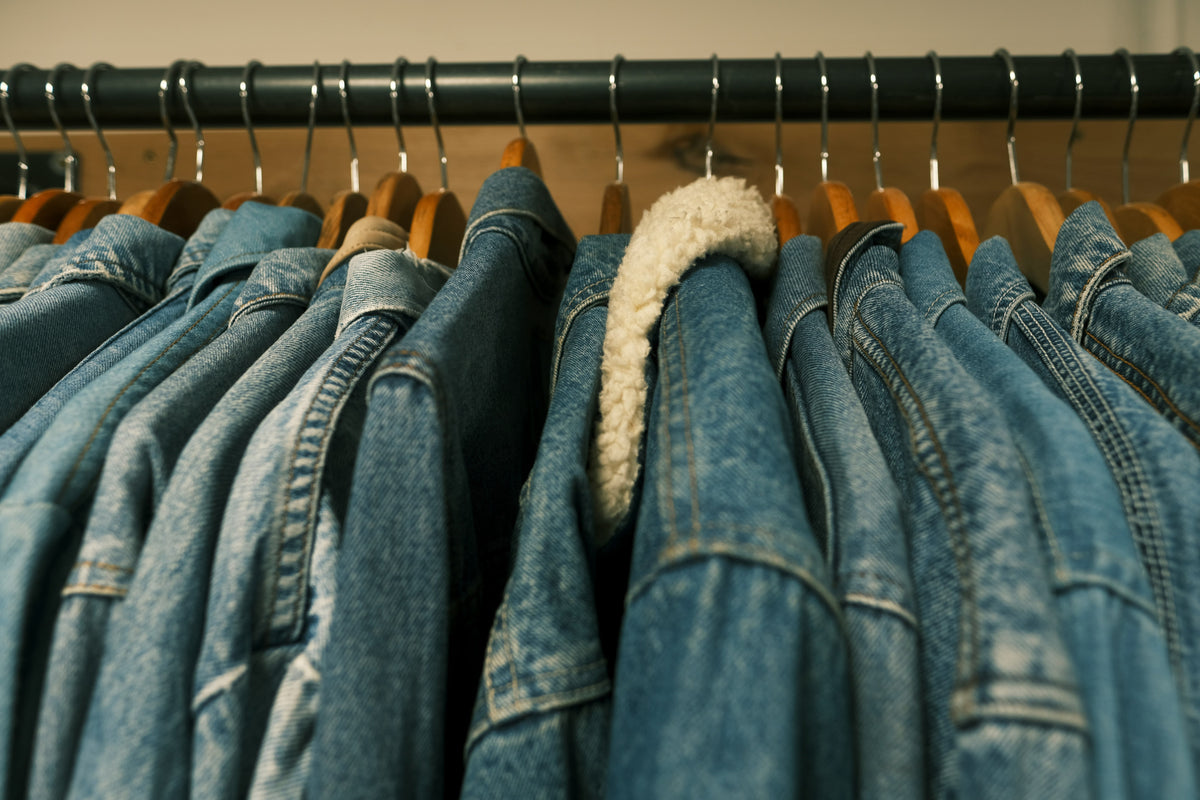 A rail of vintage denim jackets in a range of blue washes at Brag Vintage