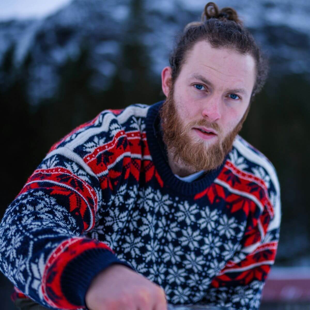 Man wearing a vintage style patterned jumper - Shop new, retro and vintage men's knitwear at Brag Vintage